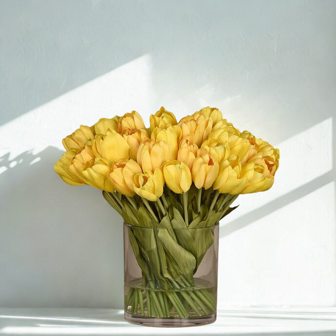 Large Tulip Arrangement in a round glass vase
