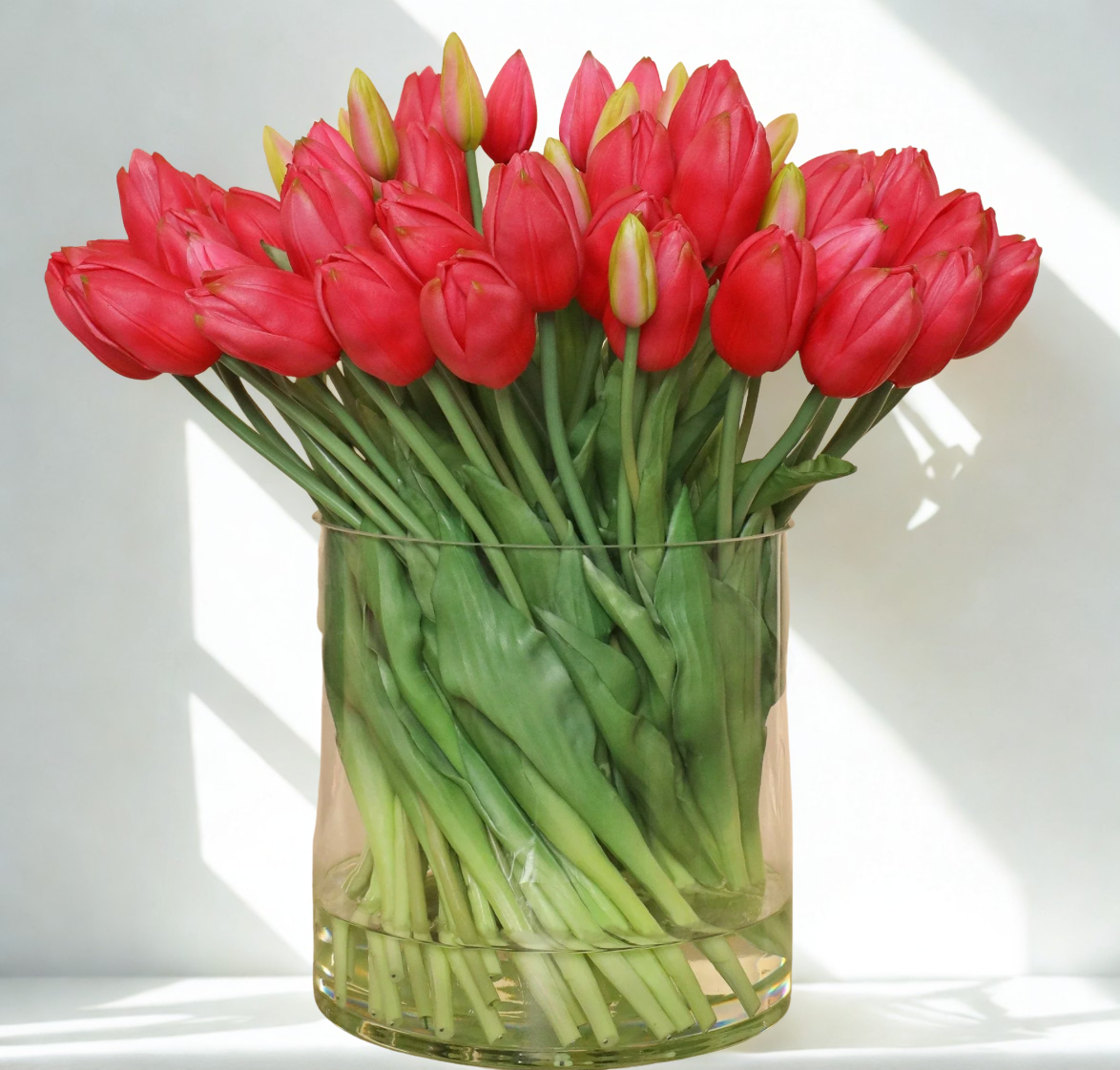 Red Tulip Arrangement in Glass Vase